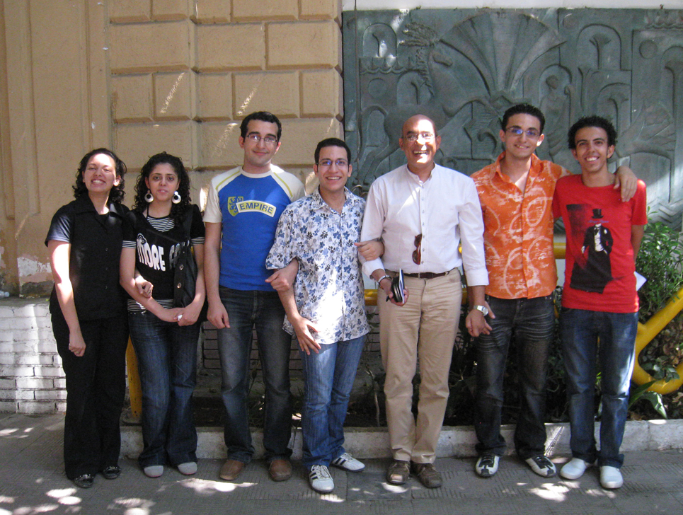 Professor Hazem Taha Hussein and students who received the computers.